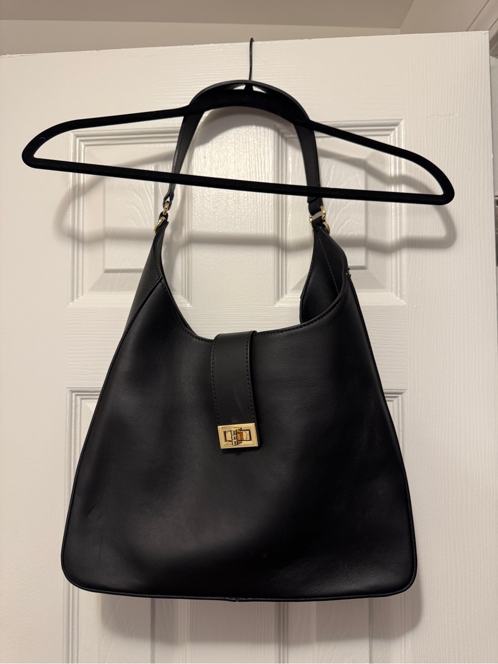 Sleek Black Leather Shoulder Bag with Gold Turn-Lock